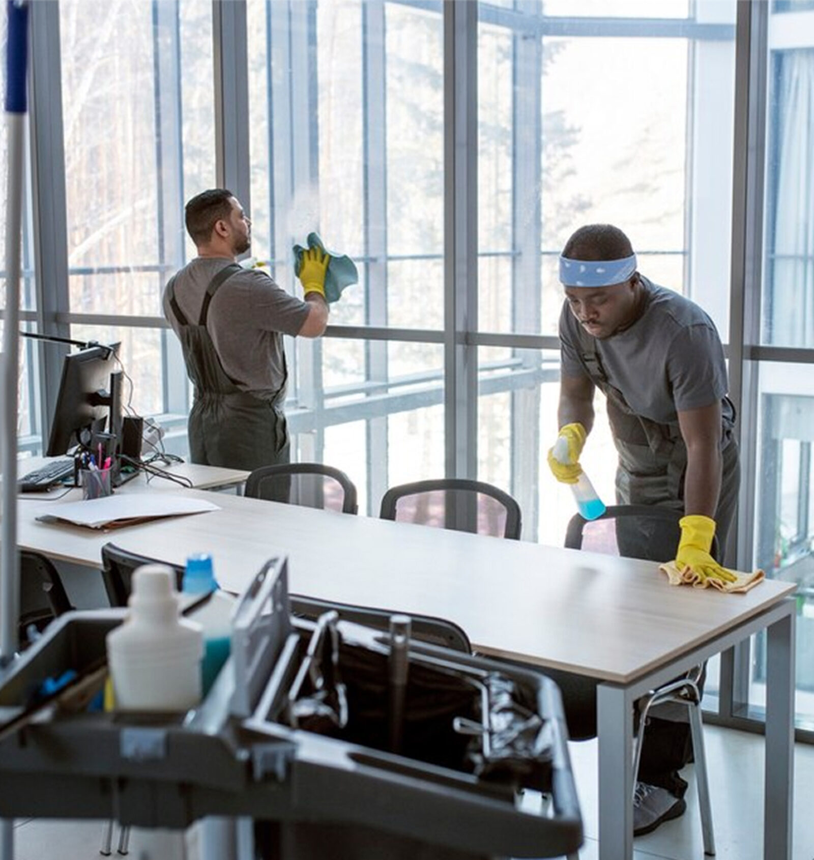 Day porter maintaining a commercial lobby during business hours